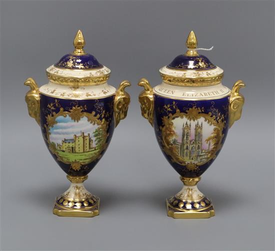 A pair of commemorative Coalport lidded two handled urns height 24cm